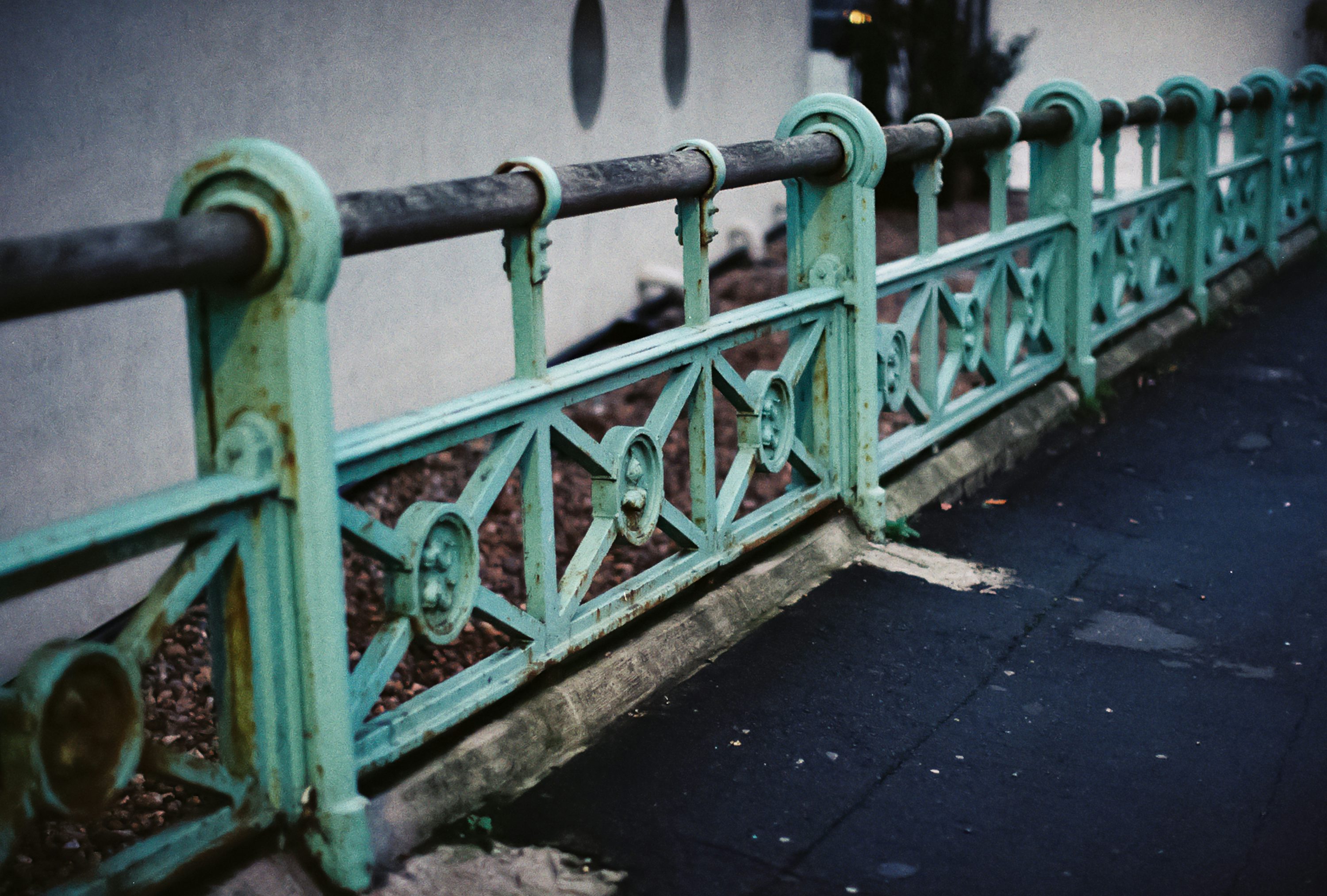 weathered seaside promenade railing
