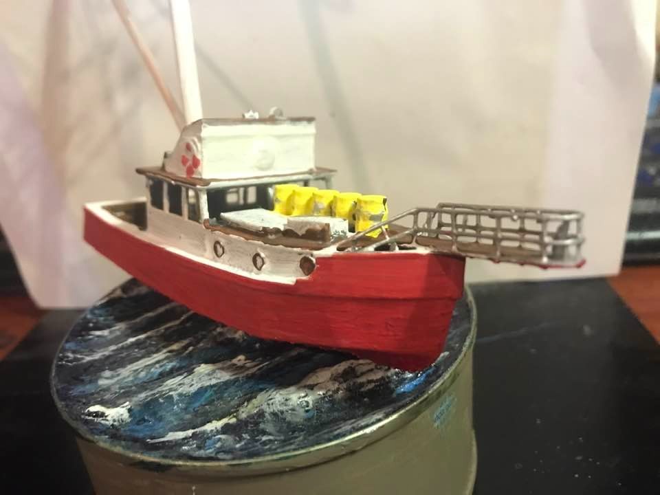 miniature fishing boats on quay