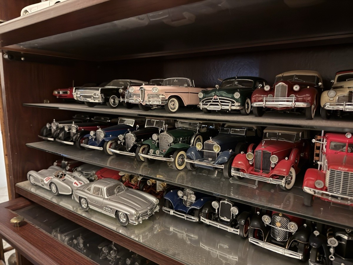 antique diecast cars on shelf